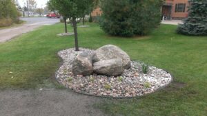 Accent bed with boulders by Twin Oaks Landscaping
