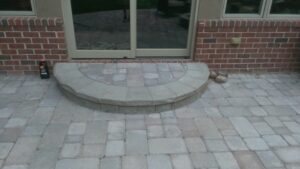 Brick paver patio and step by Twin Oaks Landscaping
