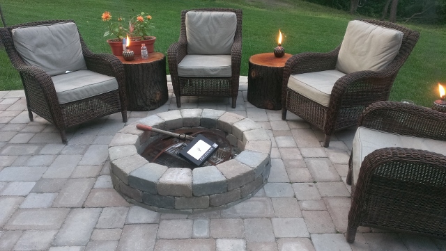 outdoor living paver fireplace and patio