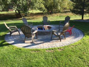 Outdoor living space brick paver patio and firepit