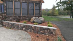 Landscaping with boulder accent by Twin Oaks Landscaping