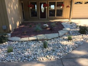 Raised bed with natural stone by Twin Oaks Landscaping