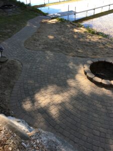 Brick paver firepit and walkway by Twin Oaks Landscaping