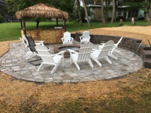 Brick paver firepit and outdoor living space by Twin Oaks Landscaping