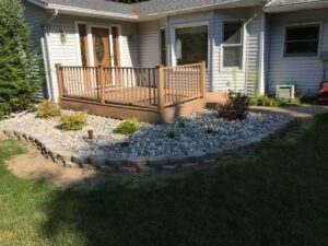 Natural stone softscape and retaining wall by Twin Oaks Landscaping